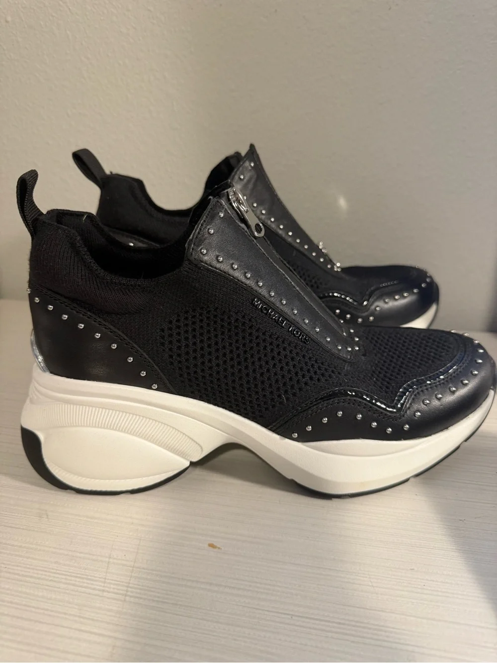 Michael Kors Zuma Black and White Zip-Front Platform Sneakers with Stud Detail